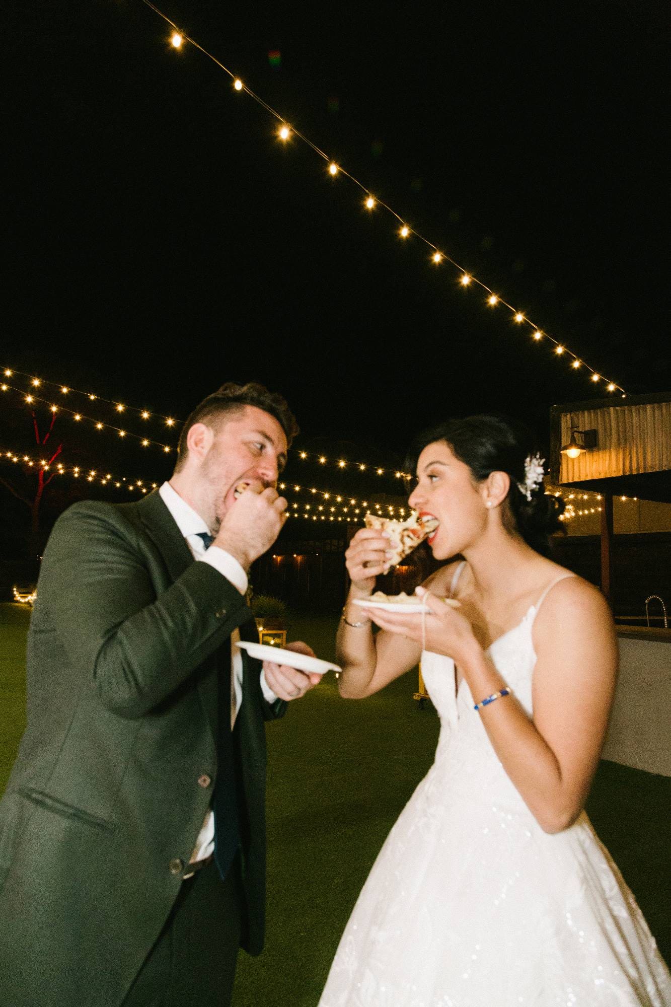 A newlywed eating a pizza together